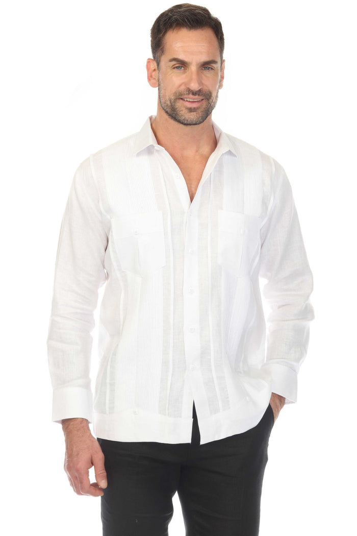 Man wears a red Yarn Dyed Linen Guayabera shirt with multi-pleats and two pockets, and white pants.