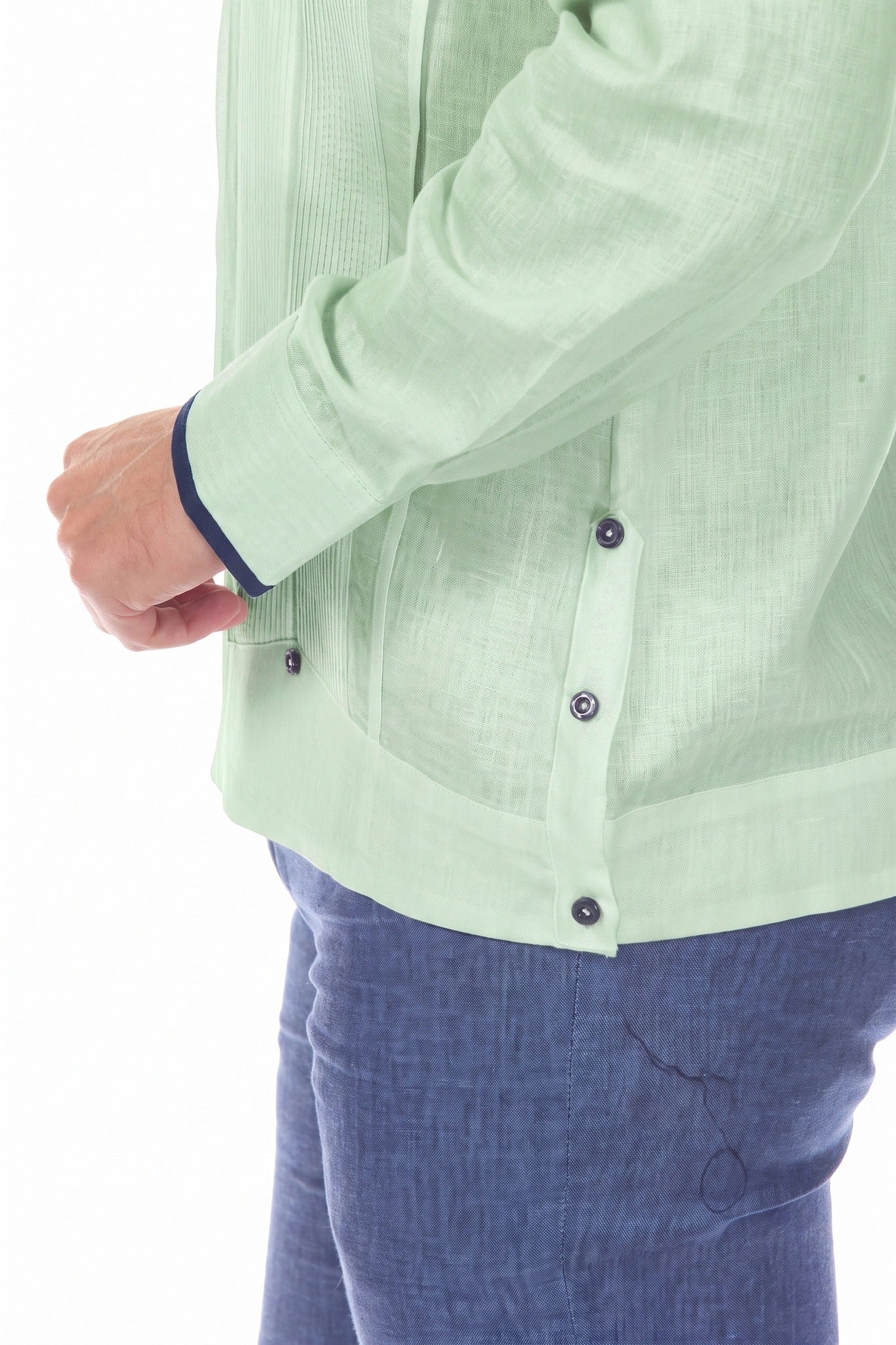 Close-up of the sage green 100% Linen Contrast Panel Guayabera Shirt Long Sleeve, showing the cuff, button detail and contrast panel.