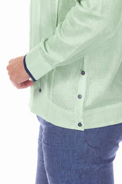 Close-up of the sage green 100% Linen Contrast Panel Guayabera Shirt Long Sleeve, showing the cuff, button detail and contrast panel.