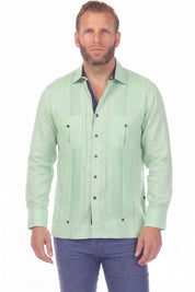 Front view of a man wearing the sage green 100% Linen Contrast Panel Guayabera Shirt Long Sleeve with navy contrasting trim.