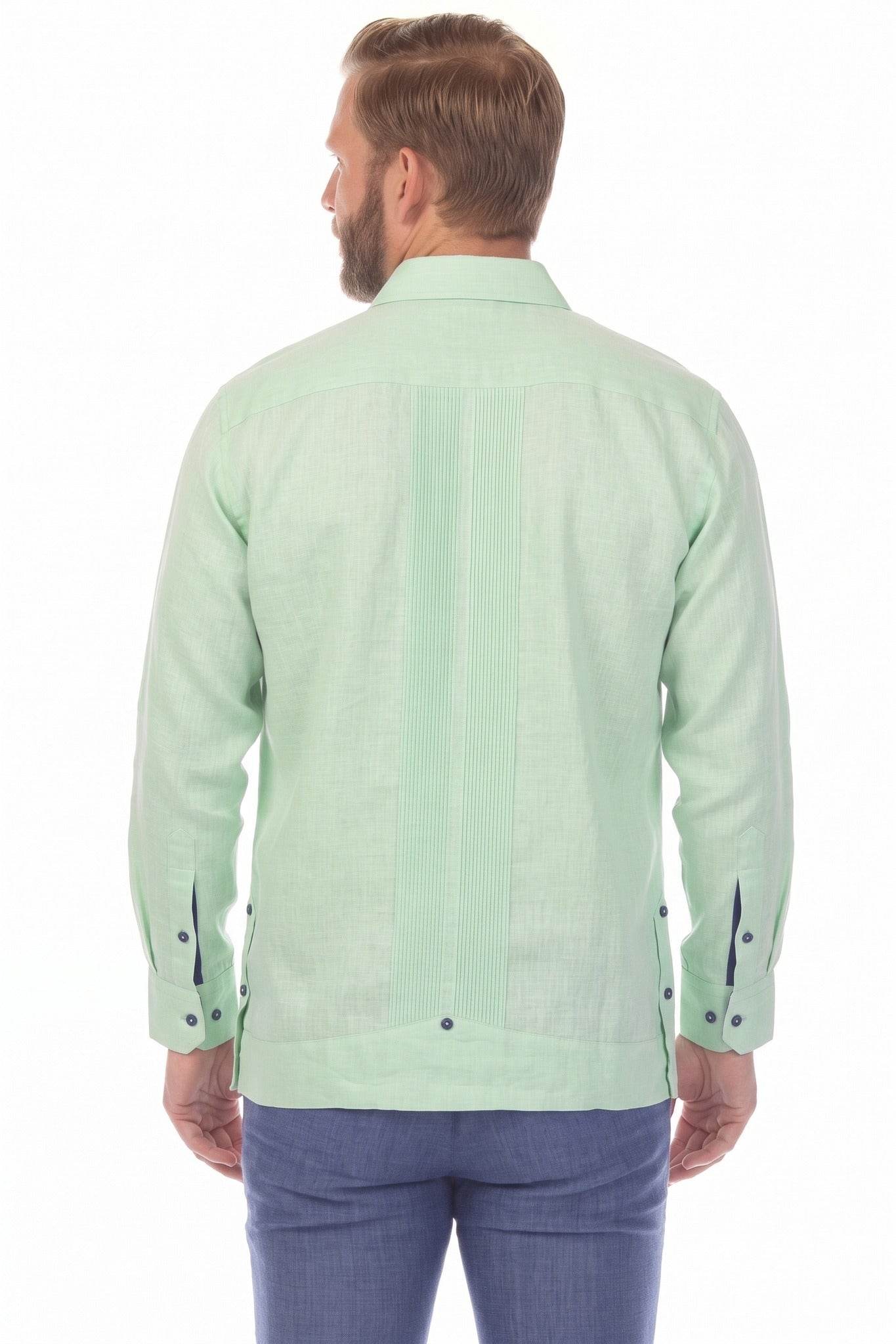 Back view of a man wearing the sage green 100% Linen Contrast Panel Guayabera Shirt Long Sleeve, showing its vertical panel detail.