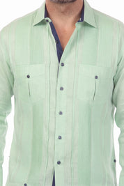 Close-up of the sage green 100% Linen Contrast Panel Guayabera Shirt with long sleeves and navy contrast trim.