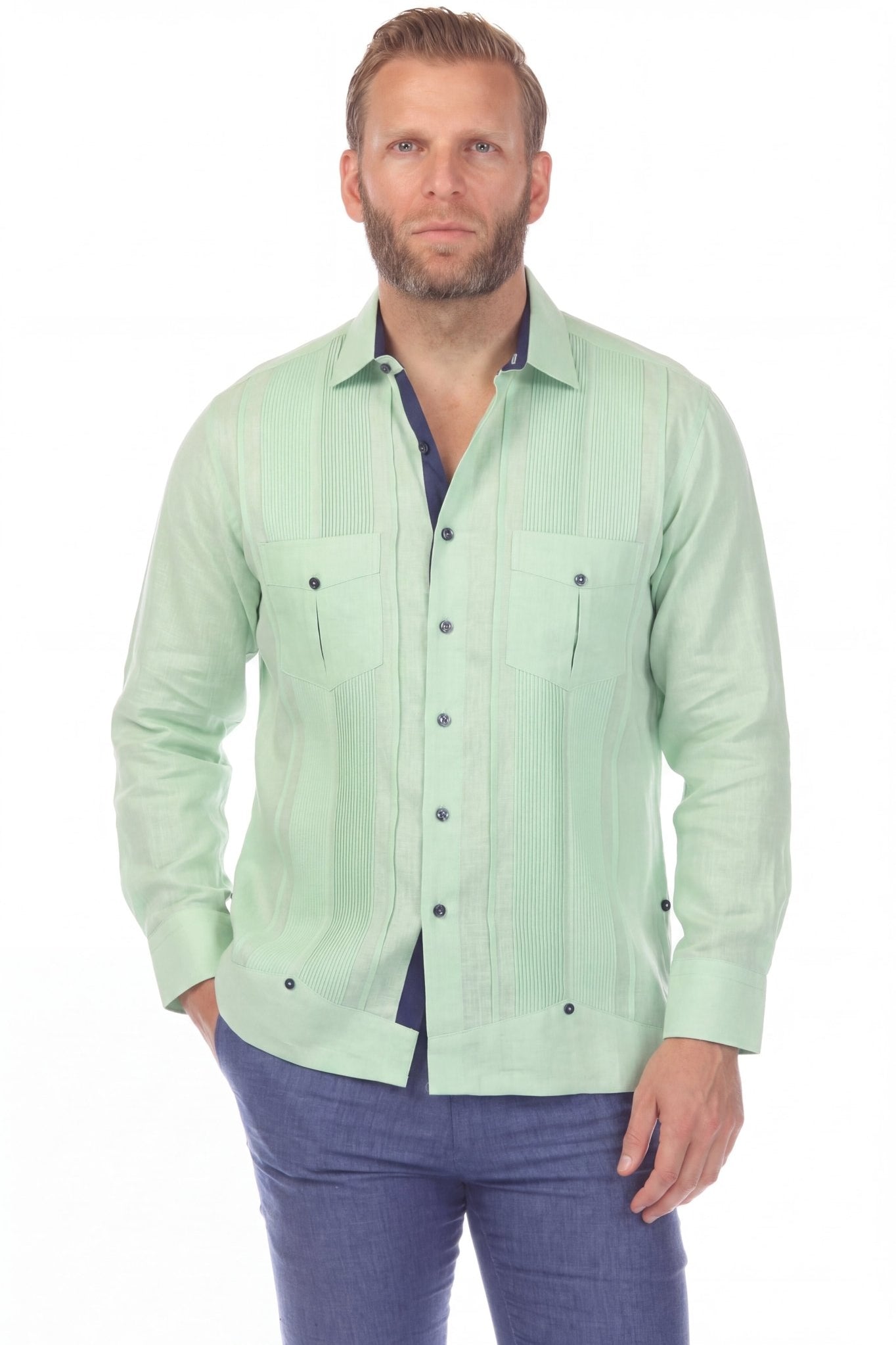 Front view of a man wearing the 100% Linen Contrast Panel Guayabera Shirt Long Sleeve in Green with blue trim.