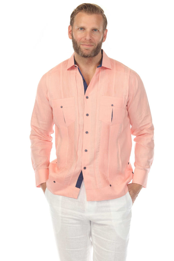 Front view of a man wearing the 100% Linen Contrast Panel Guayabera Shirt Long Sleeve in peach with blue trim.