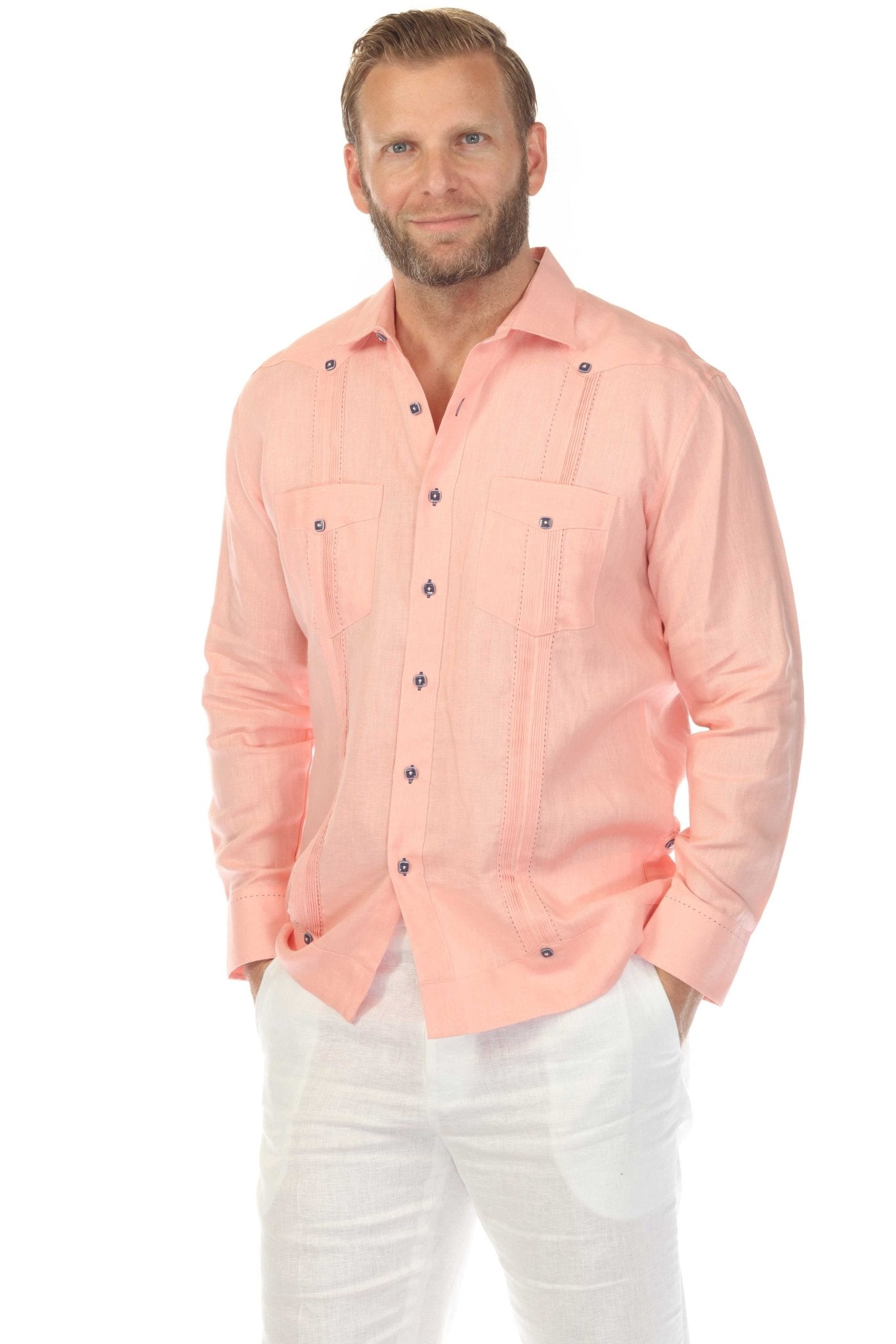 Man in a peach 100% Linen Contrast Panel Guayabera Shirt with long sleeves and white pants.