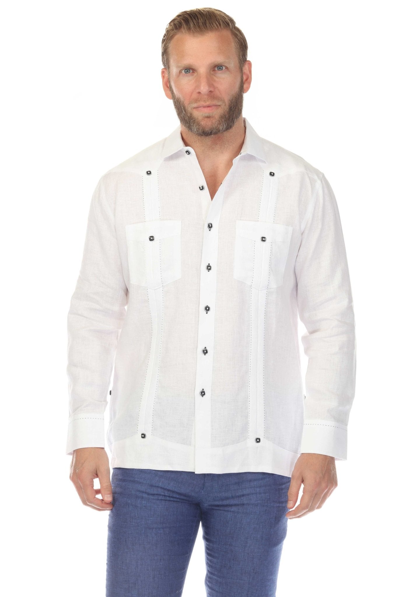 Front view of a man wearing a white 100% Linen Two Pocket Fancy Guayabera.