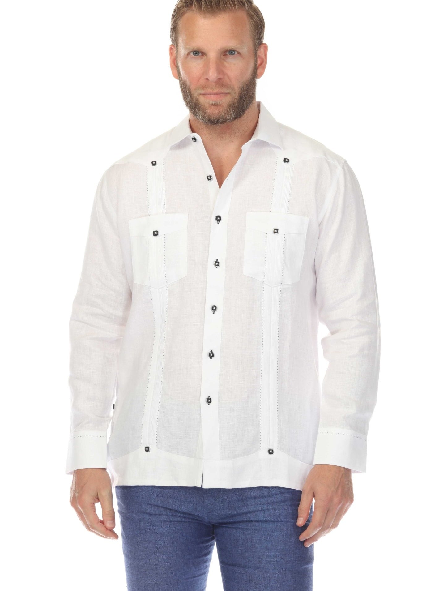 Front view of a man wearing a white Men's 100% Linen Two Pocket Fancy Guayabera with decorative pintuck panels.