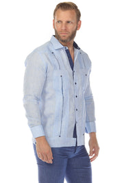 Profile of a man wearing a light blue 100% Linen Contrast Panel Guayabera Shirt Long Sleeve featuring dark blue panels.