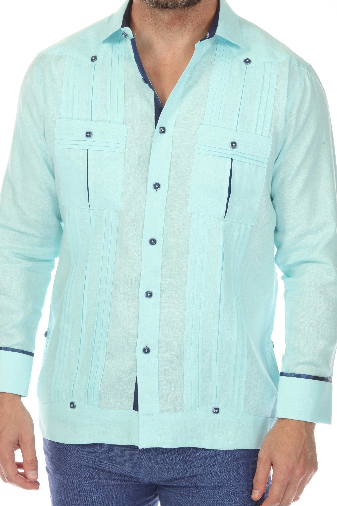 Close-up of a man wearing a light blue 100% Linen Contrast Panel Guayabera Shirt Long Sleeve, showing pleated panels.