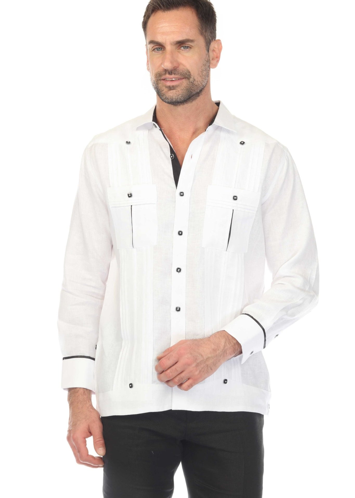 Man in a white Men's Premium Linen Guayabera Shirt with two pockets, wide pleating and black contrast trim.