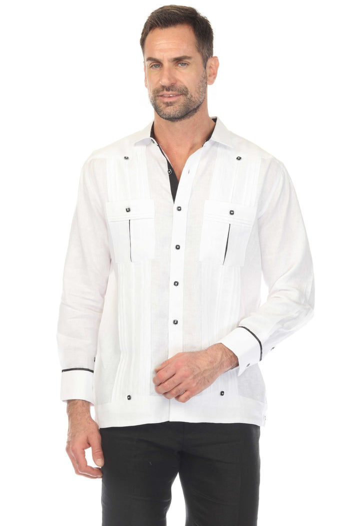 Person in white 100% Linen Contrast Panel Guayabera Shirt, long sleeve, seated, unbuttoning shirt to reveal contrast panel.