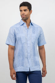 Man wearing a light blue short-sleeve shirt with a white background