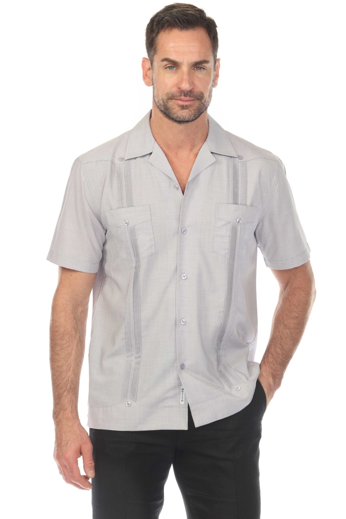 Front view of a man wearing a light gray Men’s Two-Pocket Cross-Dye Guayamisa Shirt with Pleats.