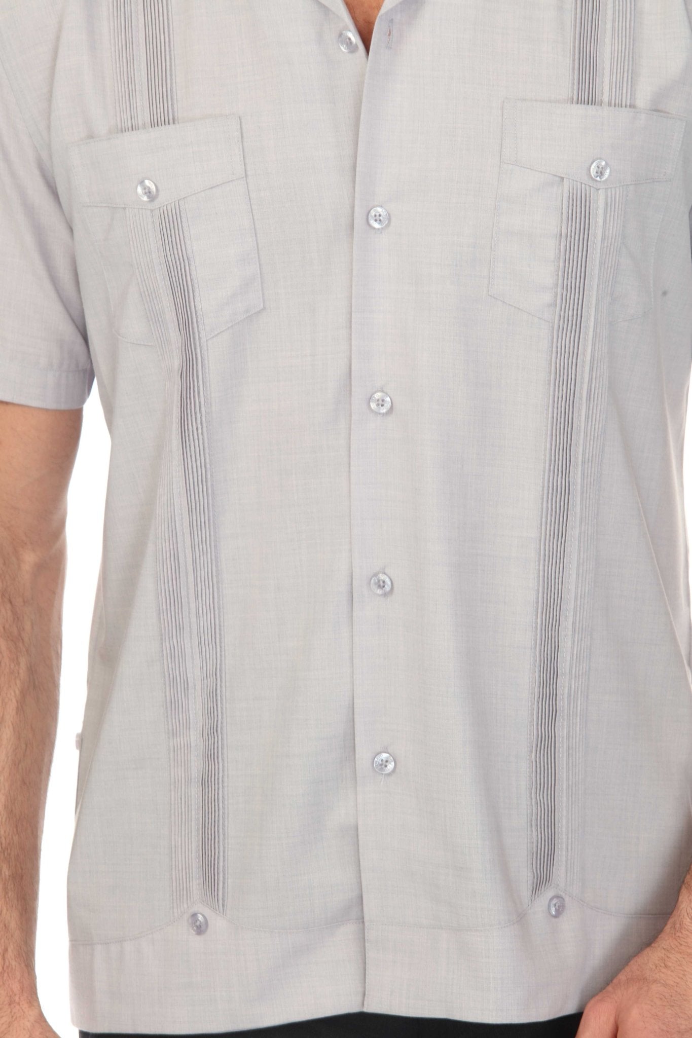 Close-up of a light gray Men’s Two-Pocket Cross-Dye Guayamisa Shirt with Pleats, showing two front pockets.