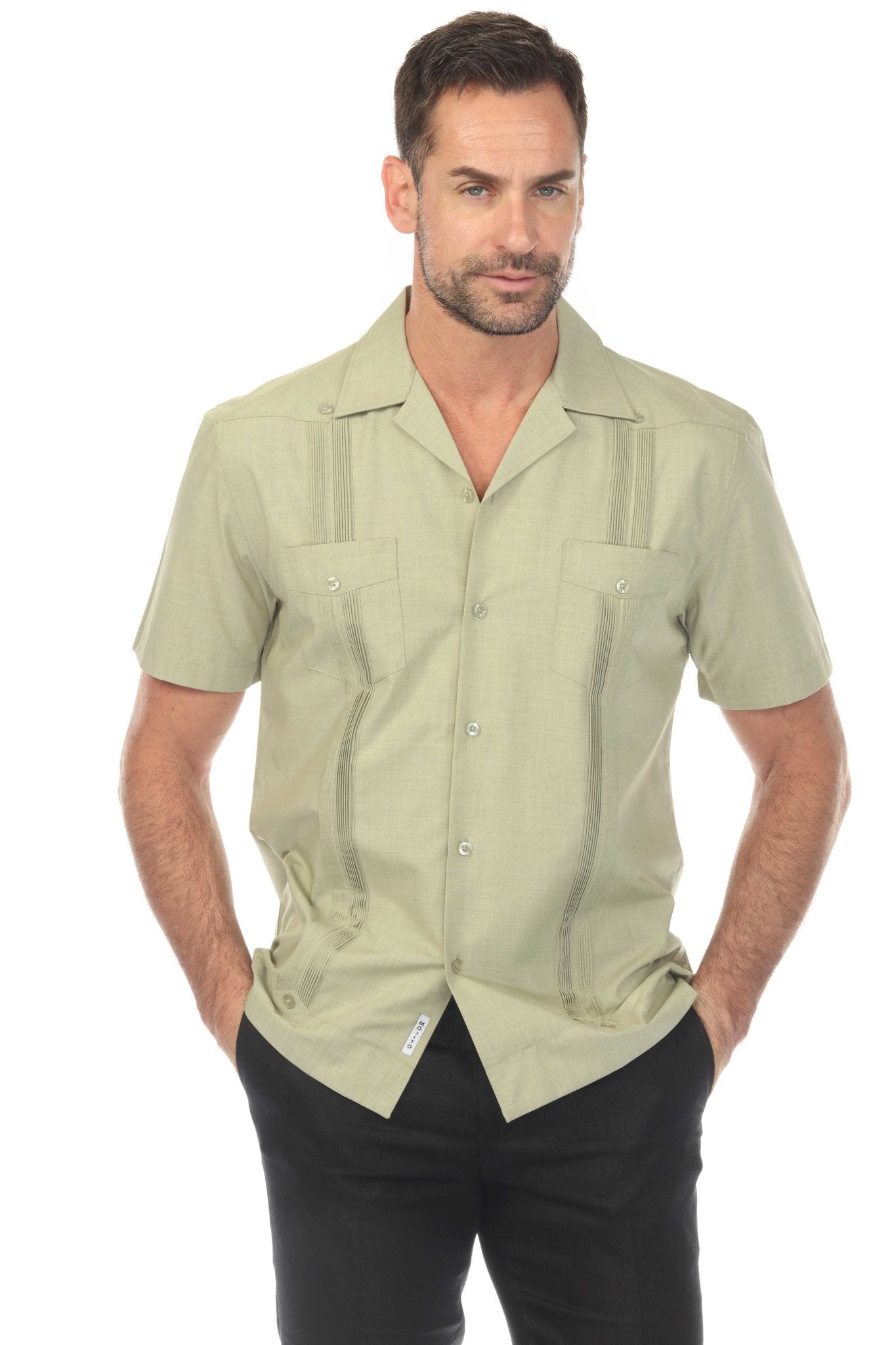 Man wearing the light green, short-sleeve Men’s Two-Pocket Cross-Dye Guayamisa Shirt with Pleats.