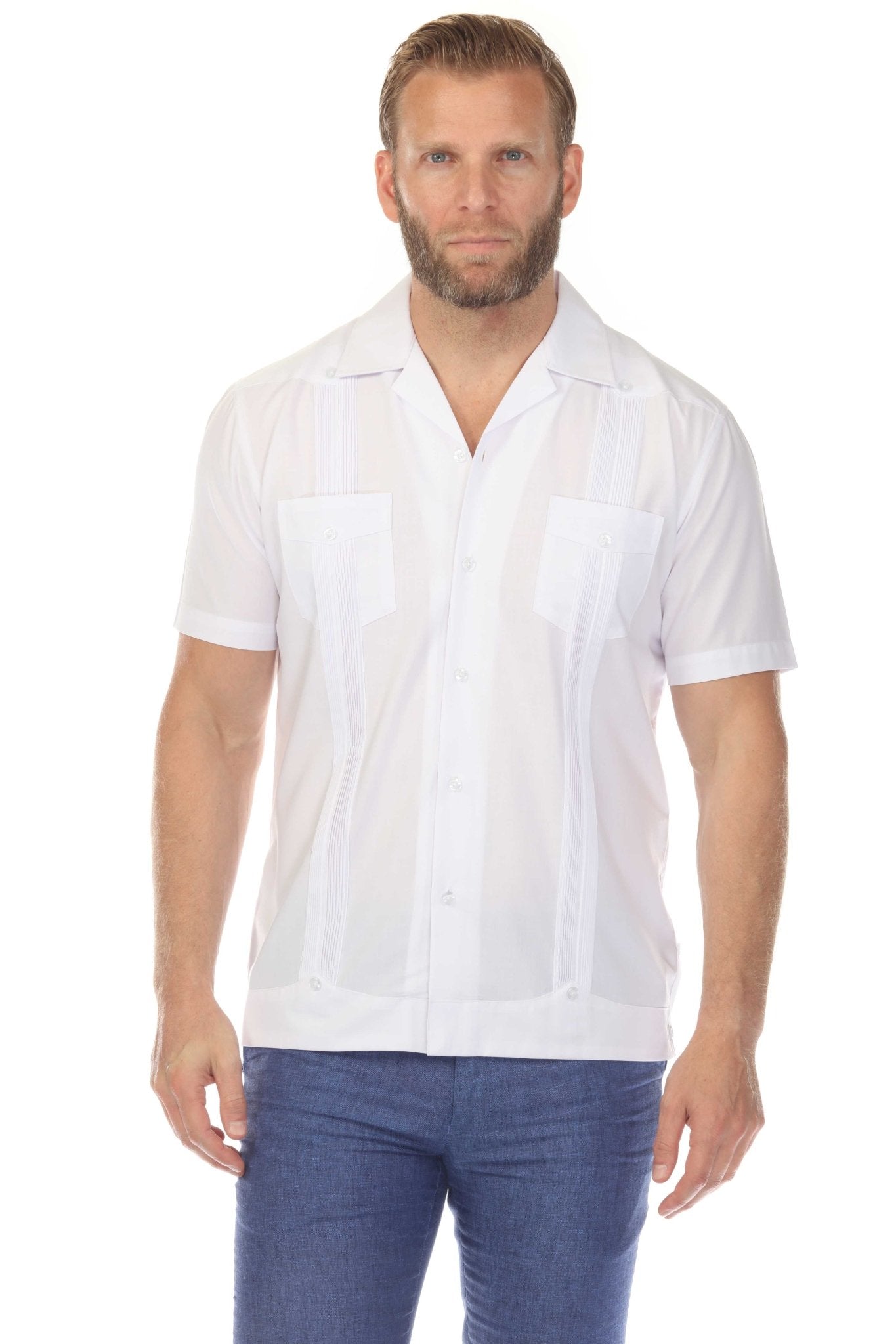 Front view of a man wearing a white Men’s Two-Pocket Cross-Dye Guayamisa Shirt with Pleats and short sleeves.