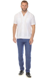 Front view of a man wearing a white Men’s Two-Pocket Cross-Dye Guayamisa Shirt with Pleats, paired with blue jeans.