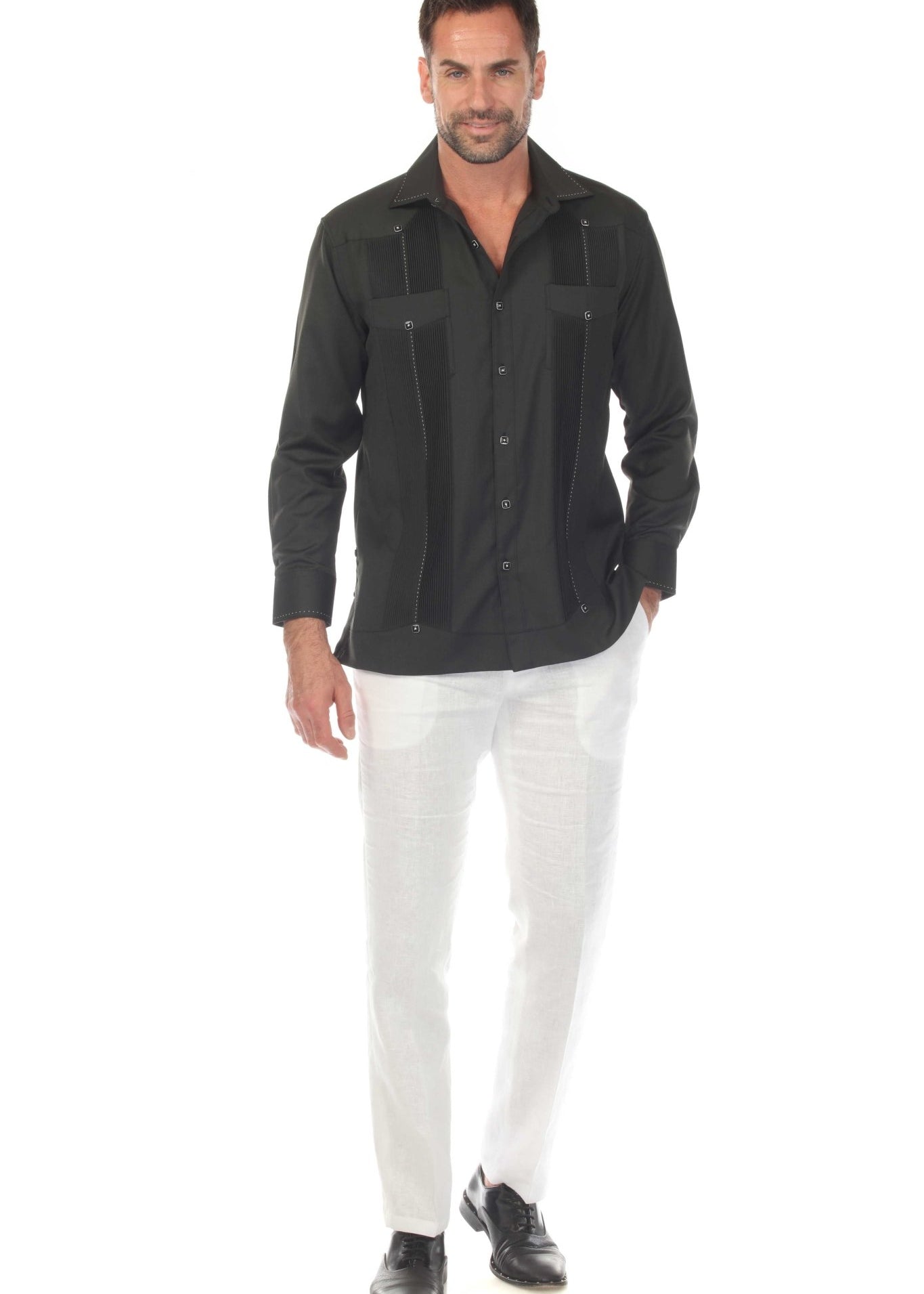 Front view of a man wearing a Black, long sleeve, two-pocket Guayabera Shirt with pick stitching.