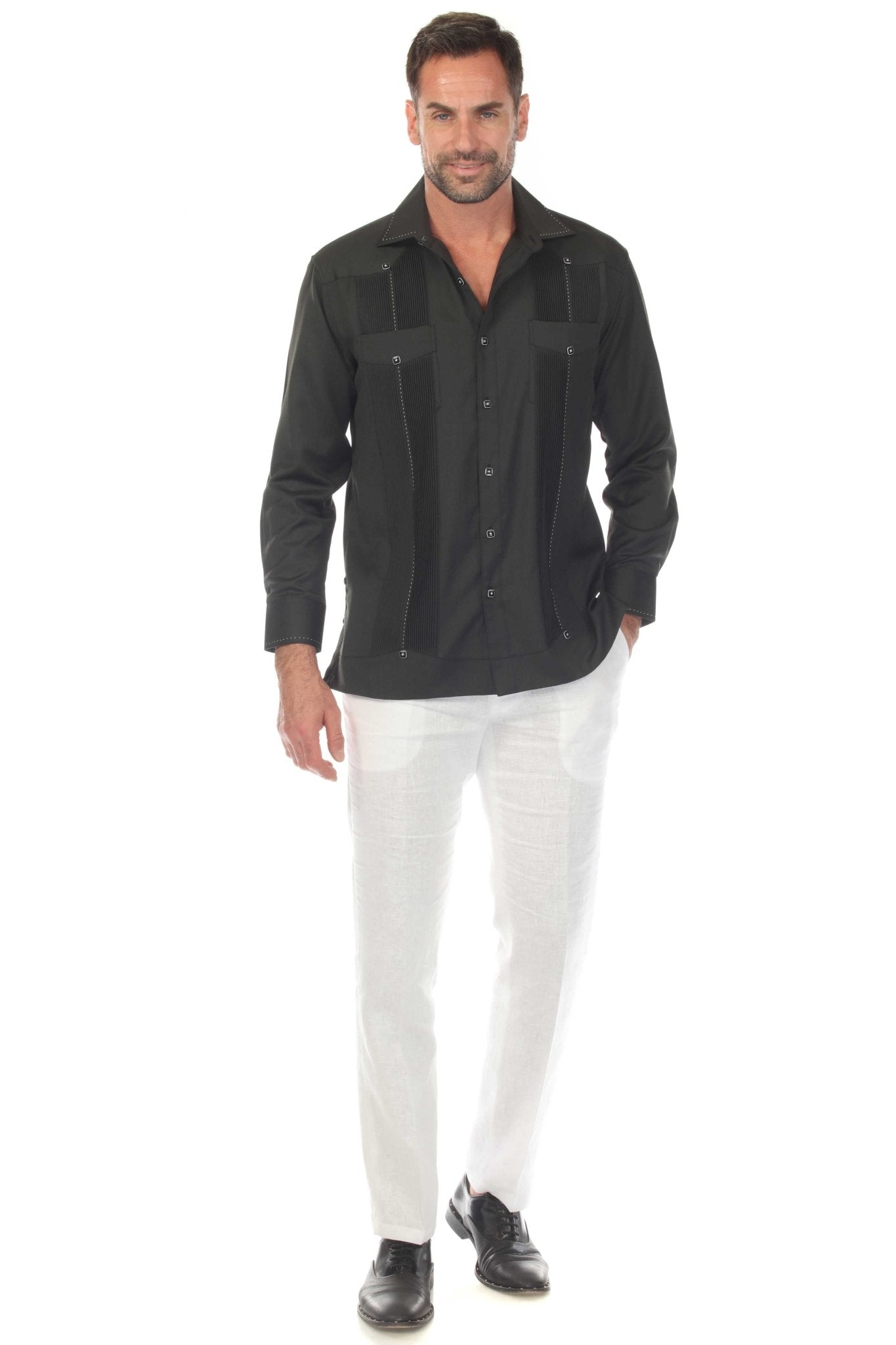 Front view of a man wearing a Black, long sleeve, two-pocket Guayabera Shirt with pick stitching.