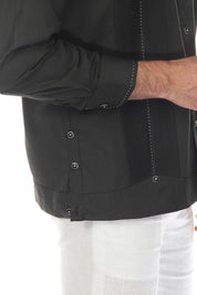 Close-up of a dark gray Men’s Long Sleeve Two-Pocket Guayabera Shirt, showing pick stitching and decorative buttons.