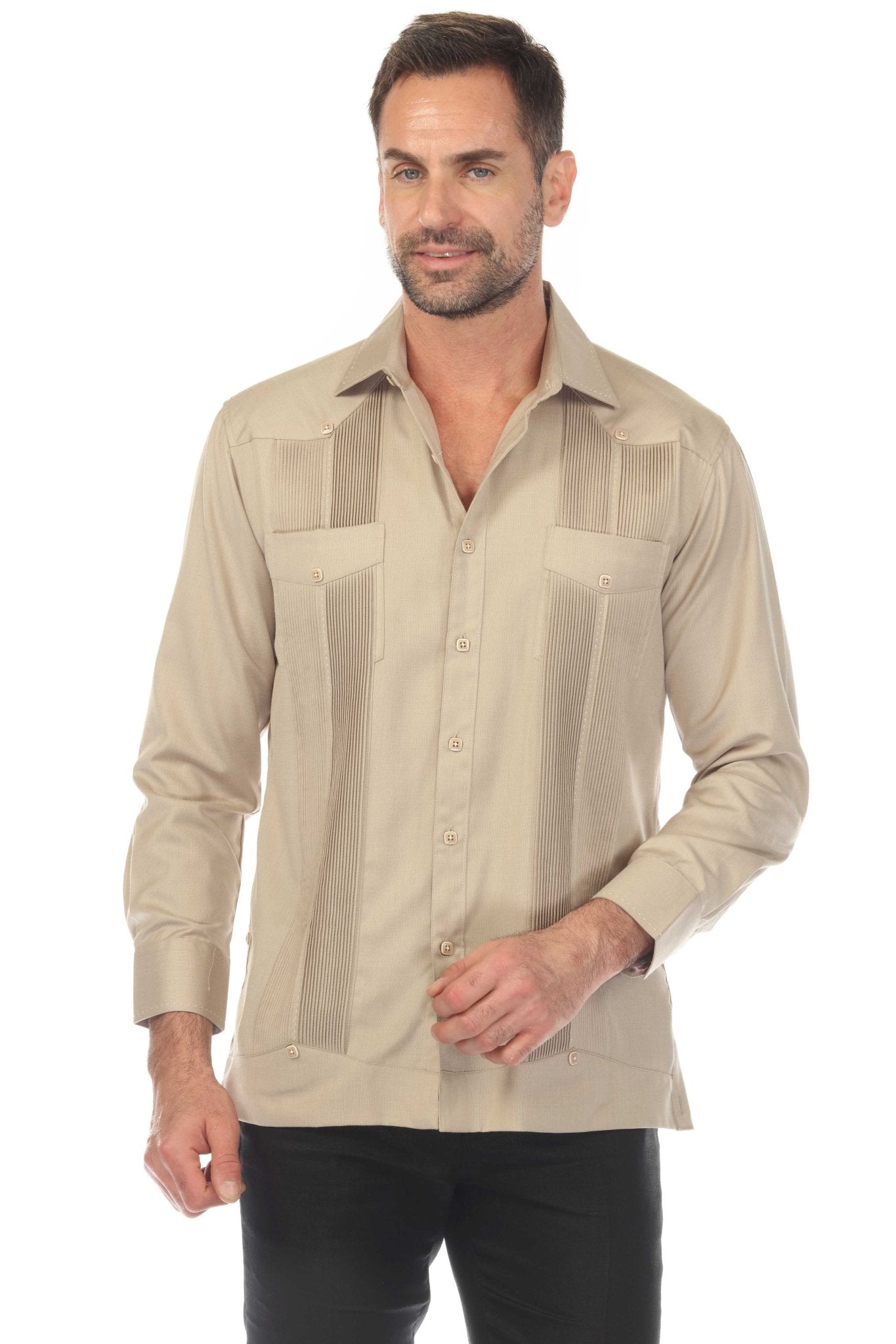 A man wears the tan, long-sleeve, two-pocket Guayabera shirt, buttoned, with pick stitching detail.
