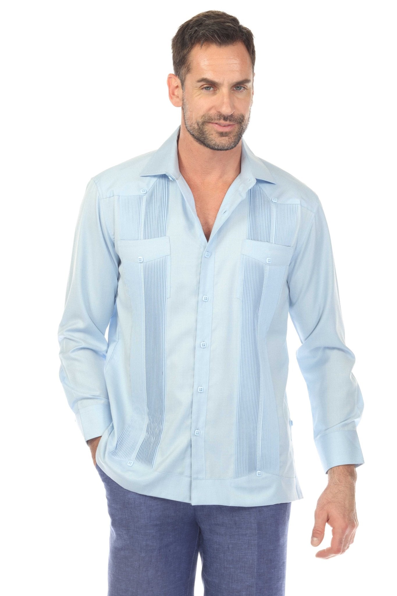 Front view of a man wearing a light blue Men’s Long Sleeve Two-Pocket Guayabera Shirt, showing pick stitching details.