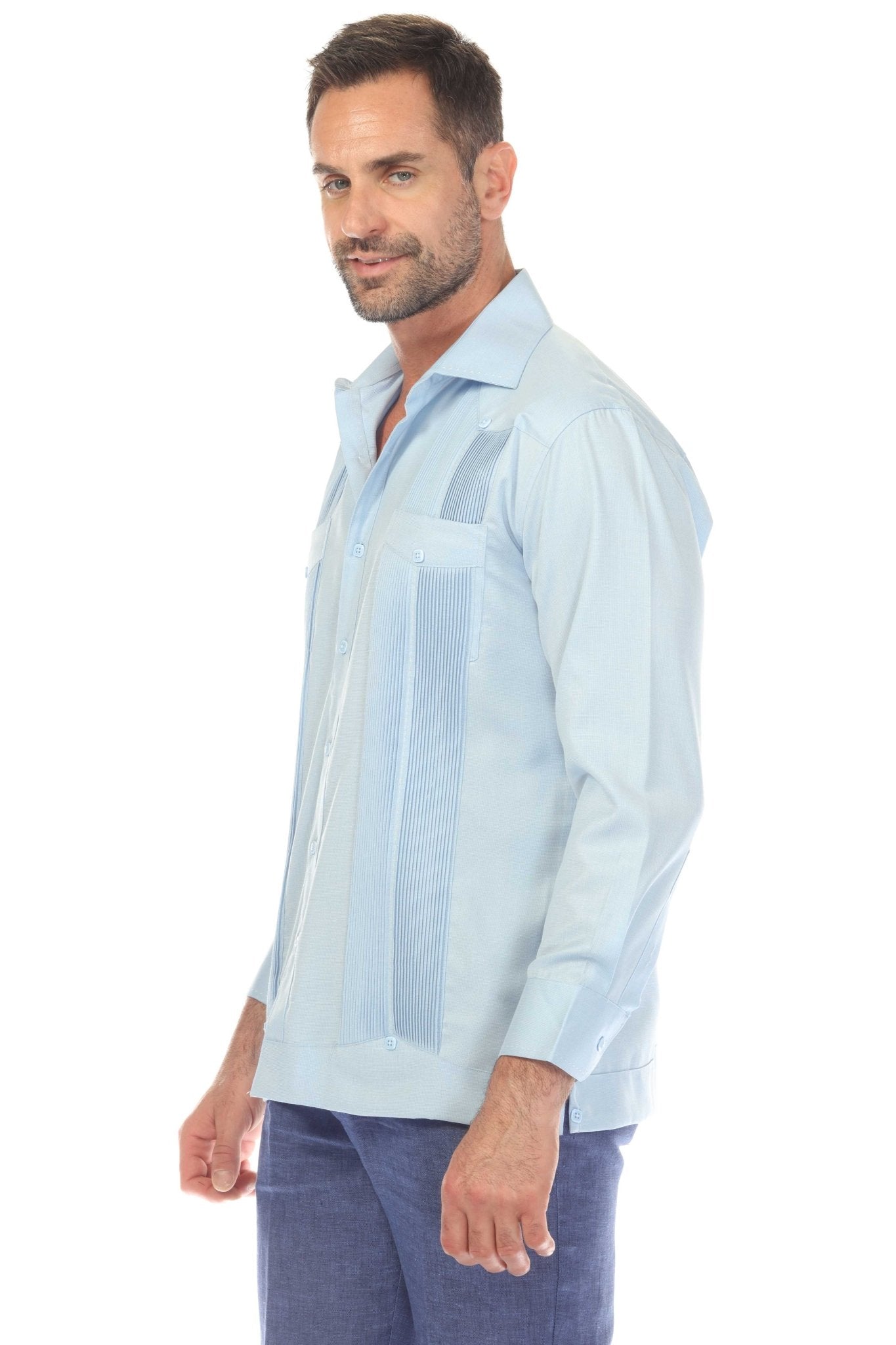 Profile view of a man wearing a light blue Men’s Long Sleeve Two-Pocket Guayabera Shirt with Pick Stitching.