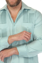 Close view of a light blue Men’s Long Sleeve Two-Pocket Guayabera Shirt with pick stitching detail.