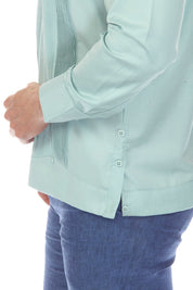 Side view of a turquoise Men’s Long Sleeve Two-Pocket Guayabera Shirt, showing the pleats and buttons.