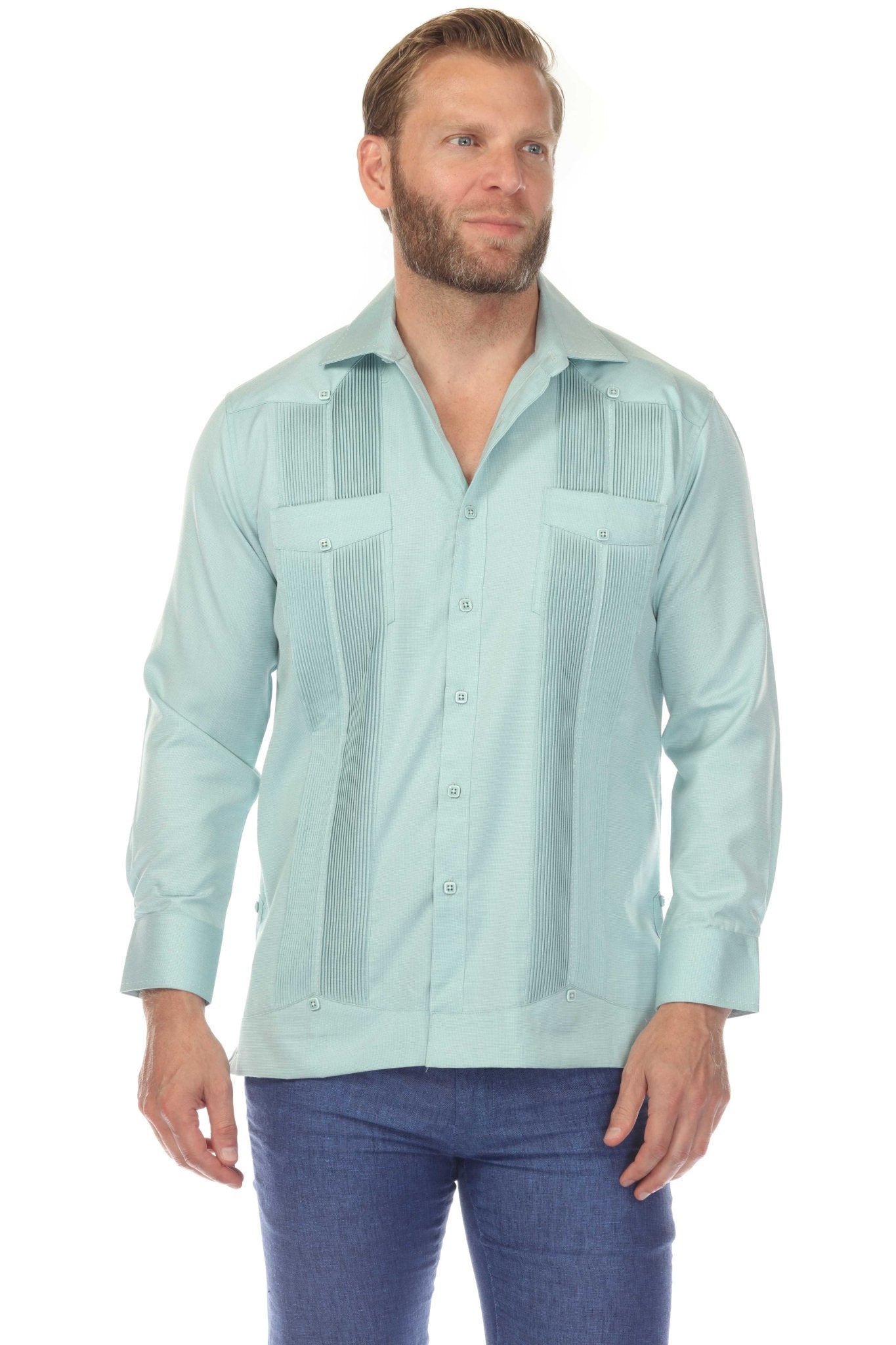 Front view of a man wearing a light blue Men’s Long Sleeve Two-Pocket Guayabera Shirt, detailed with pick stitching.