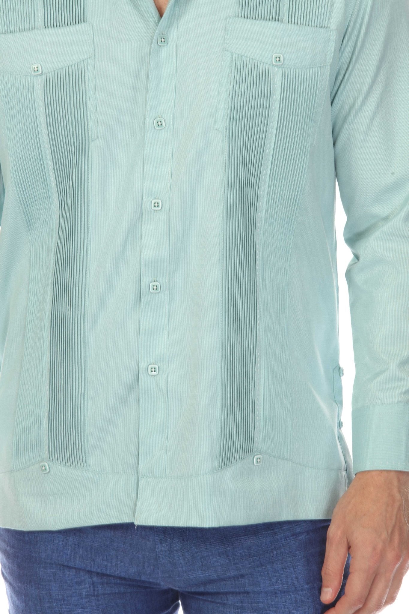 Close-up of a light blue Men’s Long Sleeve Two-Pocket Guayabera Shirt, showing pleats and pick stitching detail.