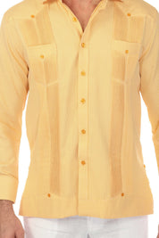 Close-up of a Mojito Reserve Men's Two-Pocket Guayabera in yellow, showing textured fabric, pockets, and button details.