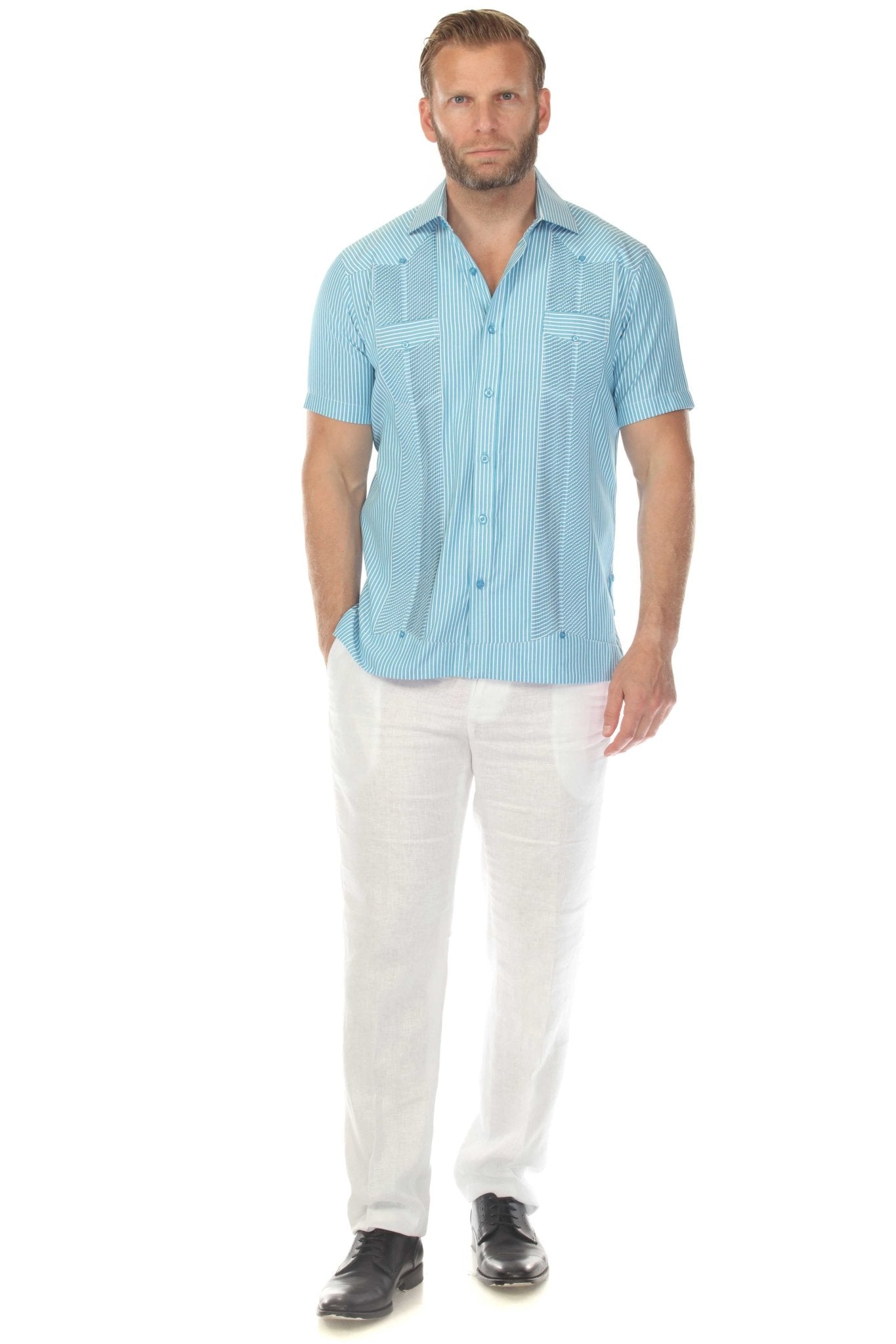 Front view of a man wearing the light blue, micro textured Men’s Two-Pocket Guayabera Shirt.