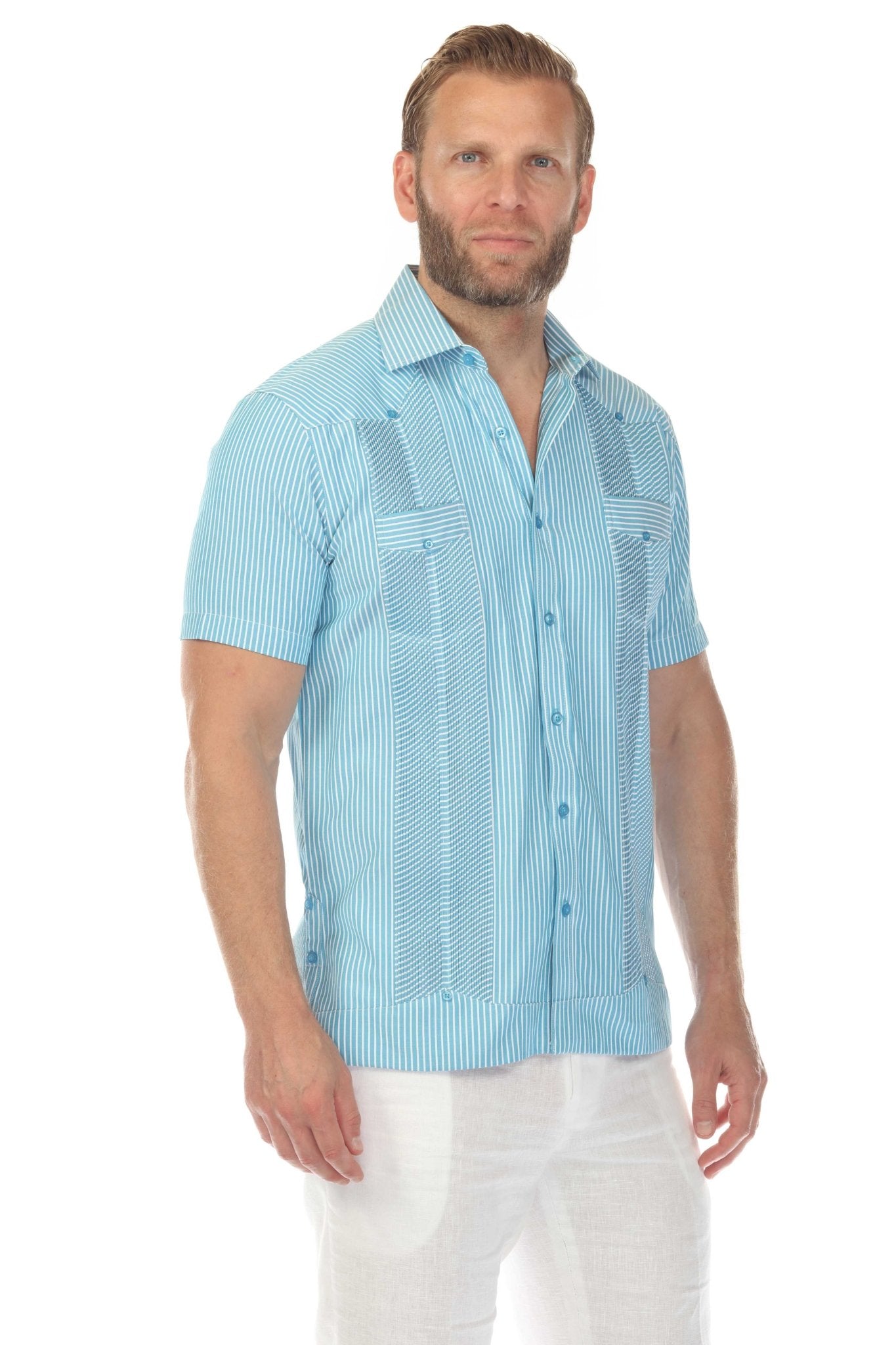 A man models the Men’s Two-Pocket Guayabera Shirt with Micro Textured Print, in light blue with white vertical stripes.