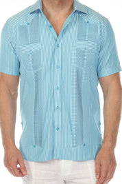 Close-up of a blue and white striped Men’s Two-Pocket Guayabera Shirt showing textured panels.