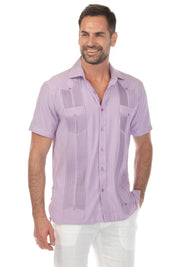 A man models a lavender and white striped Men’s Two-Pocket Guayabera Shirt with Micro Textured Print, front view.