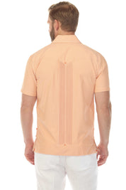 Back view of a man wearing an orange striped Men’s Two-Pocket Guayabera Shirt with a micro textured panel.