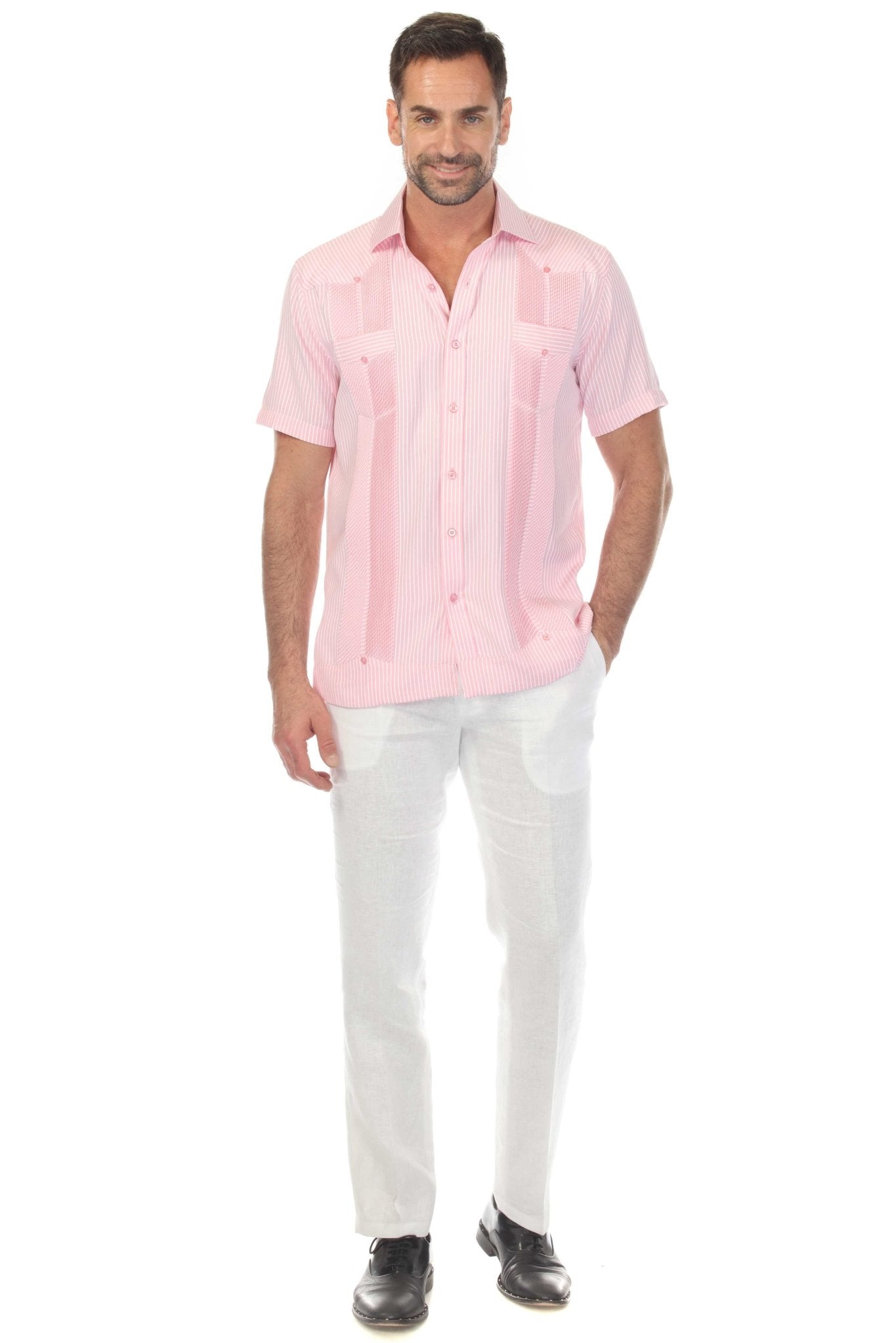 A man wears a pink striped Men’s Two-Pocket Guayabera Shirt, shown at full length with two visible pockets.