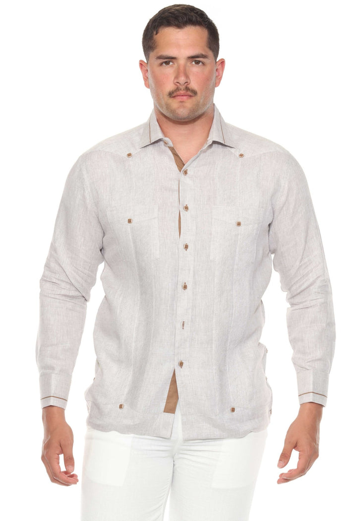 A man stands in a white Contrast Trim Linen Guayabera, showcasing the two pockets and long sleeves.