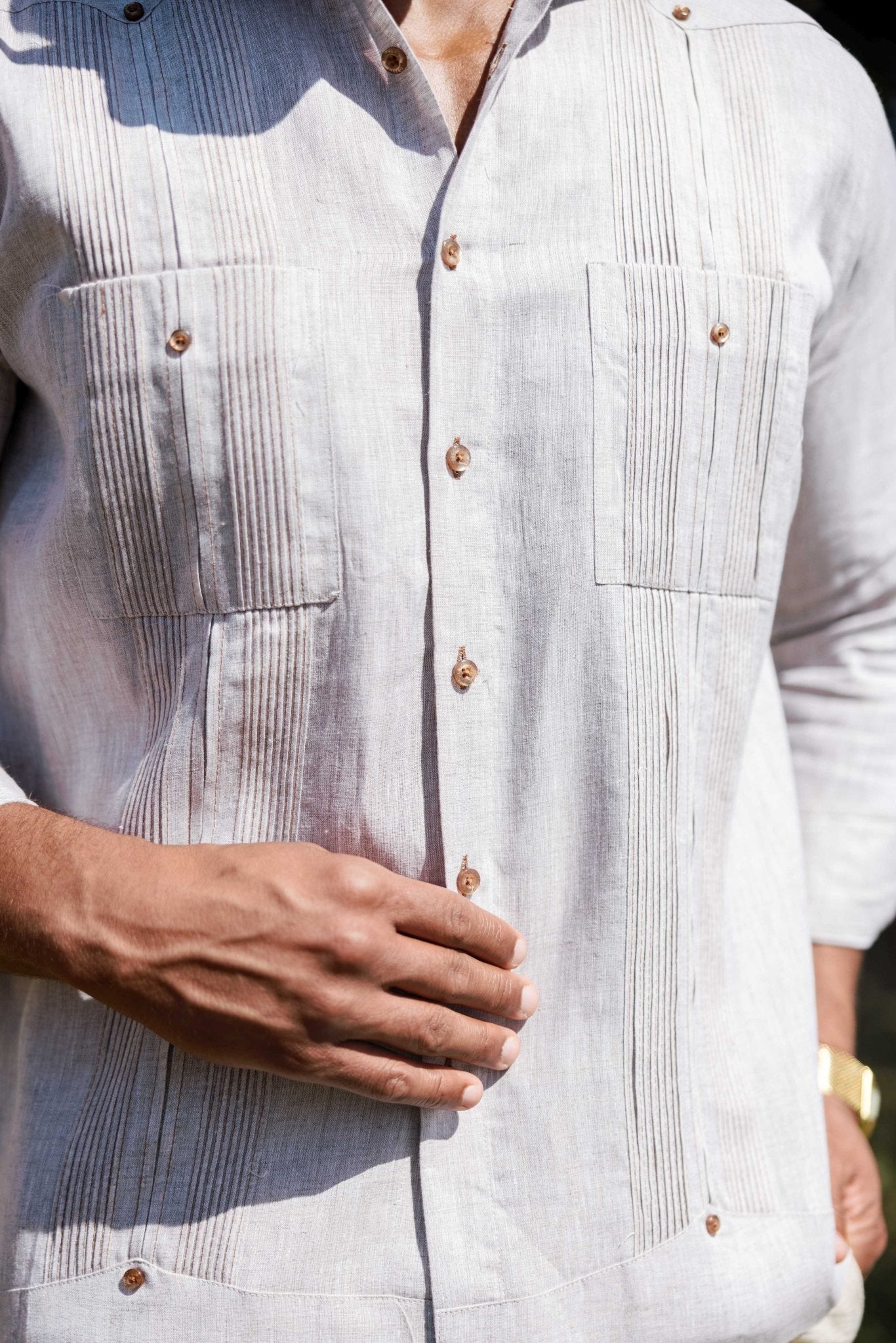 Close-up of the light gray Men’s 100% Linen Guayabera Shirt, showing long sleeves and heritage pleats.