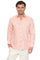 A man smiles wearing a peach long-sleeve Men’s 100% Linen Guayabera Shirt with heritage pleats.