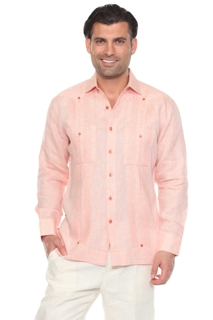 A man wears an off-white long-sleeve Men’s 100% Linen Guayabera Shirt with heritage pleats.