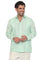 A man smiles wearing a light green, long-sleeve, 100% Linen Contrast Panel Guayabera Shirt.