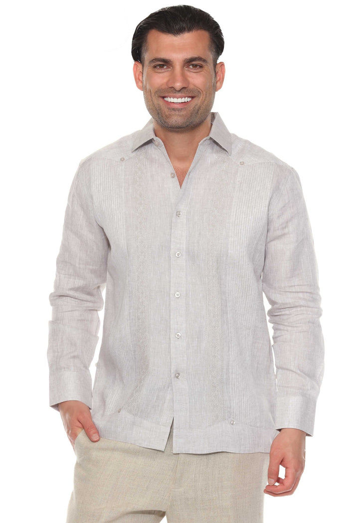 Man wearing a 100% Linen Contrast Panel Guayabera Shirt; long sleeves, light color with detailed contrast paneling.