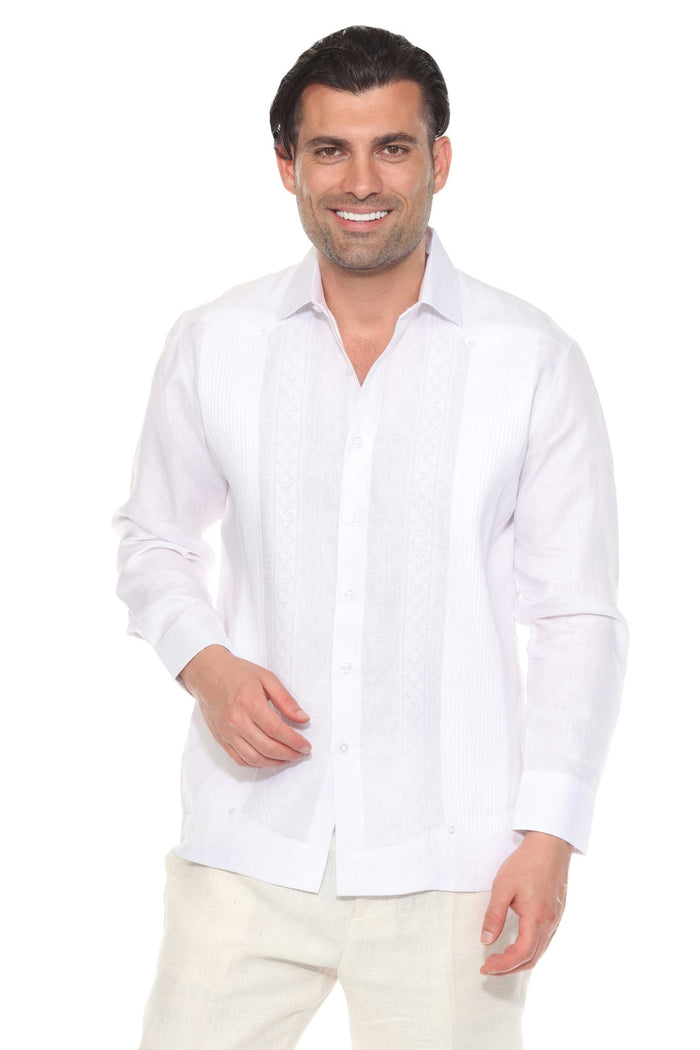 Man wearing a 100% Linen Contrast Panel Guayabera Shirt; long sleeves, light color with detailed contrast paneling.