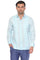Studio photo of a man wearing a light blue long sleeve guayabera with tonal pleats and blue linen trousers.