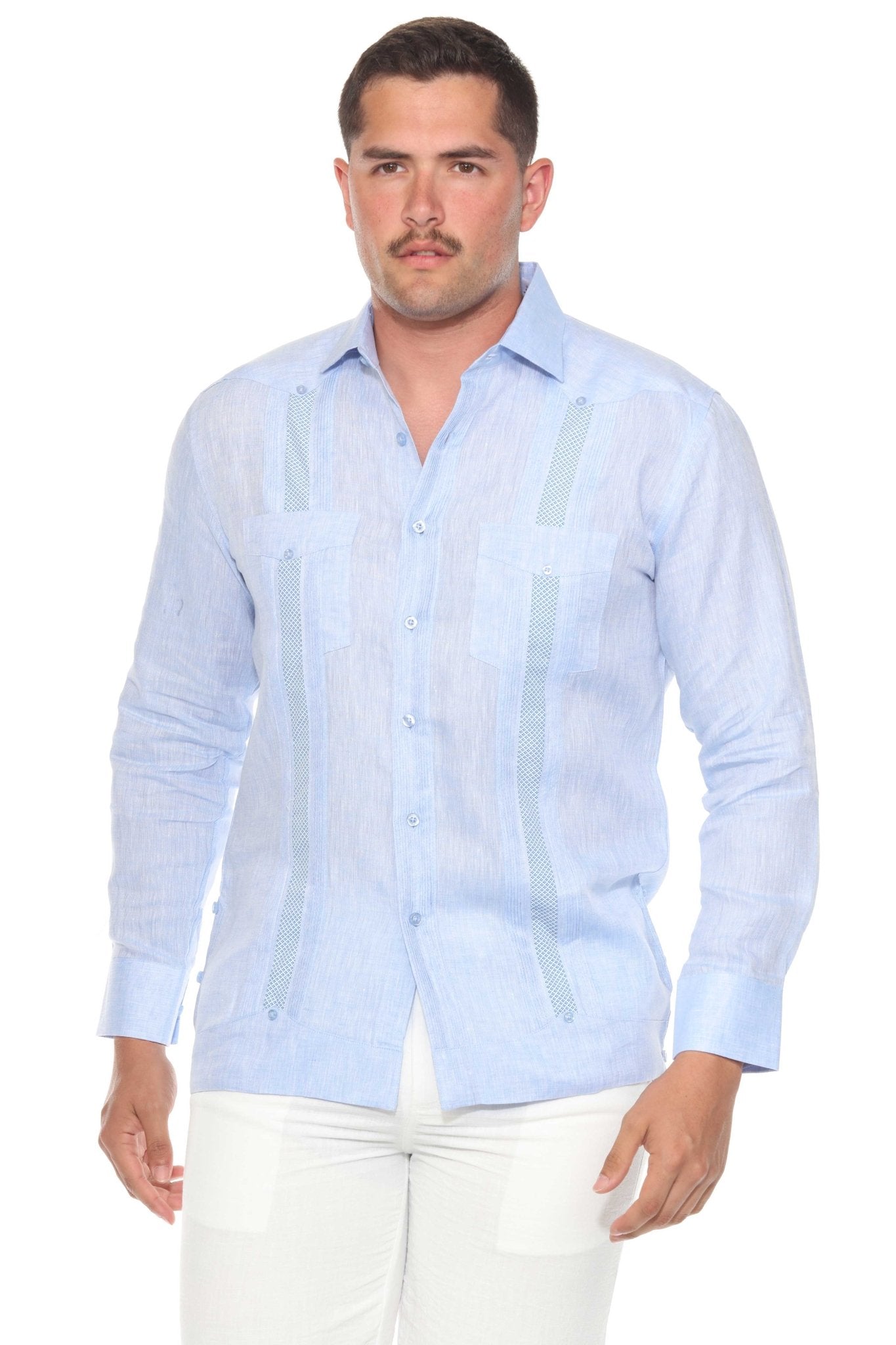 Front view of a man wearing a light blue linen Guayabera shirt with artisan embroidery detail.