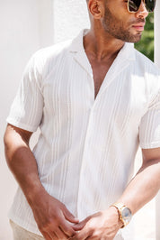 Polo elegante de primera calidad para hombre con moderno patrón de punto trenzado texturizado