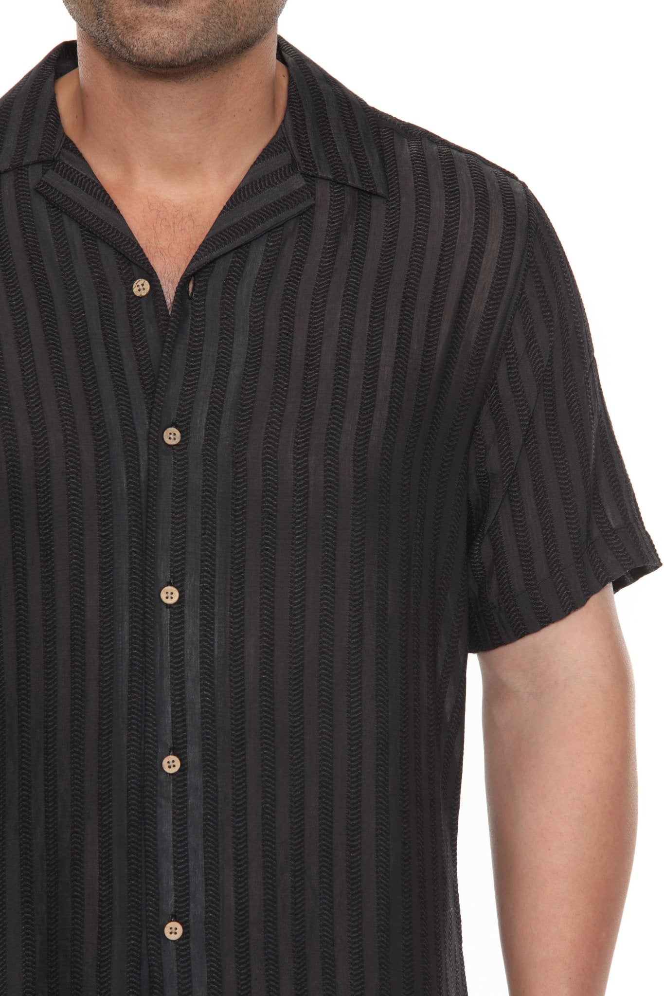 Close-up of the black striped rayon blend resort shirt, buttoned halfway, showing the collar.