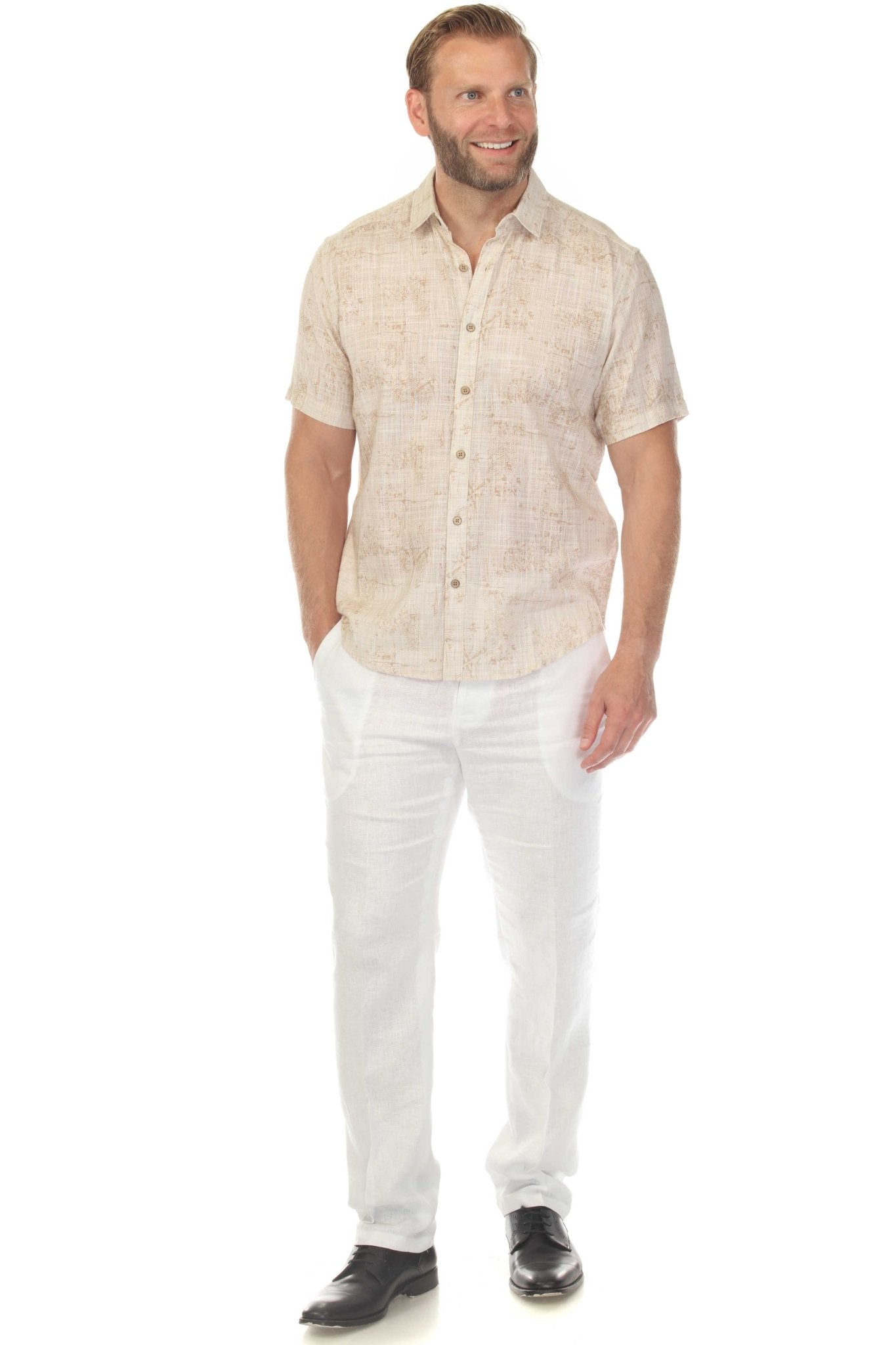 Front view of a man wearing the tan Men’s Cross Hatch Short Sleeve Button Down Resort Shirt with white pants.